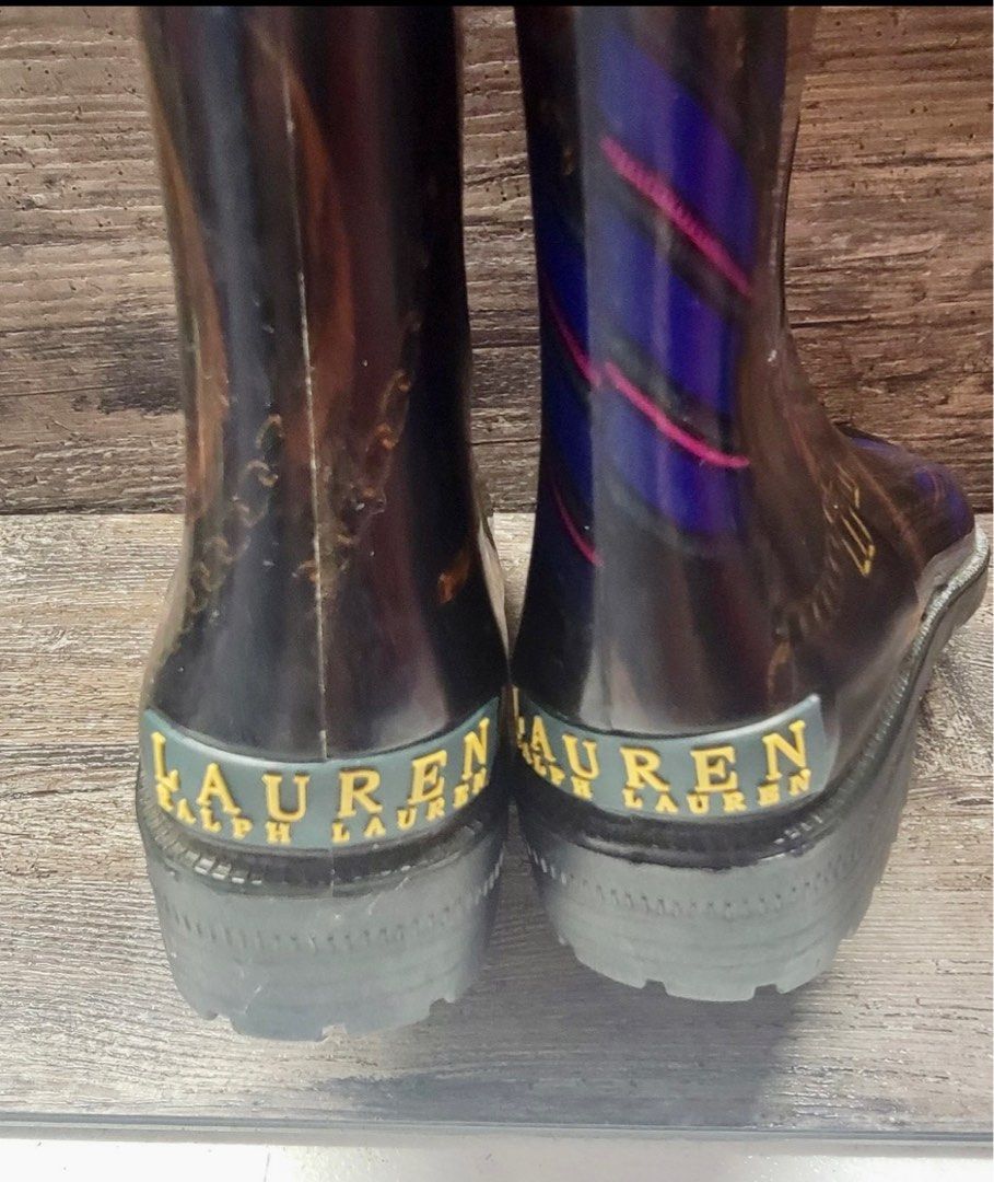Ralph Lauren Rossalyn II Rain Boots (Category: Boots) located in Las Pinas. Submitted by gwenangels7 (Listing ID 1396044973, Image 3). Description: The Lauren Ralph Lauren Rosalyn II Knee High Rain Boots in Black Gold Rope Chain, size 6, are a stylish and versatile option for women. With an almond toe shape and low block heel, these boots are perfect for casual or workwear occasions. The PVC fabric and waterproof feature make them ideal for all s