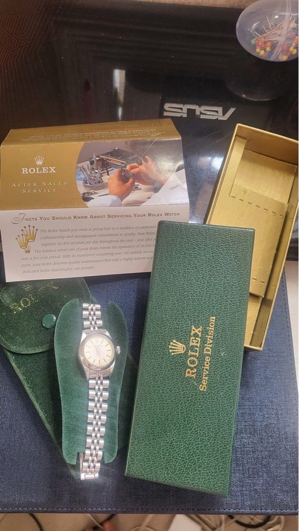 Rolex Oyster Perpetual 67180 Automatic Watch (Category: Luxury Watches) located in Muntinlupa City. Submitted by goldensnake888enterprise (Listing ID 1395984046, Image 2). Description: - Rolex Oyster Perpetual 67180 - 25mm case size - Tropical dial - Sapphire glass - All steel - Date code: 1989 - Automatic 2130 movement - Includes Rolex after-sales service case.