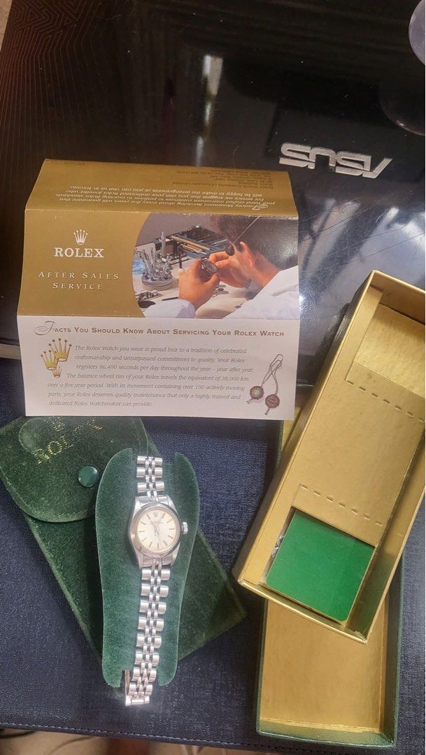 Rolex Oyster Perpetual 67180 Automatic Watch (Category: Luxury Watches) located in Muntinlupa City. Submitted by goldensnake888enterprise (Listing ID 1395984046, Image 1). Description: - Rolex Oyster Perpetual 67180 - 25mm case size - Tropical dial - Sapphire glass - All steel - Date code: 1989 - Automatic 2130 movement - Includes Rolex after-sales service case.