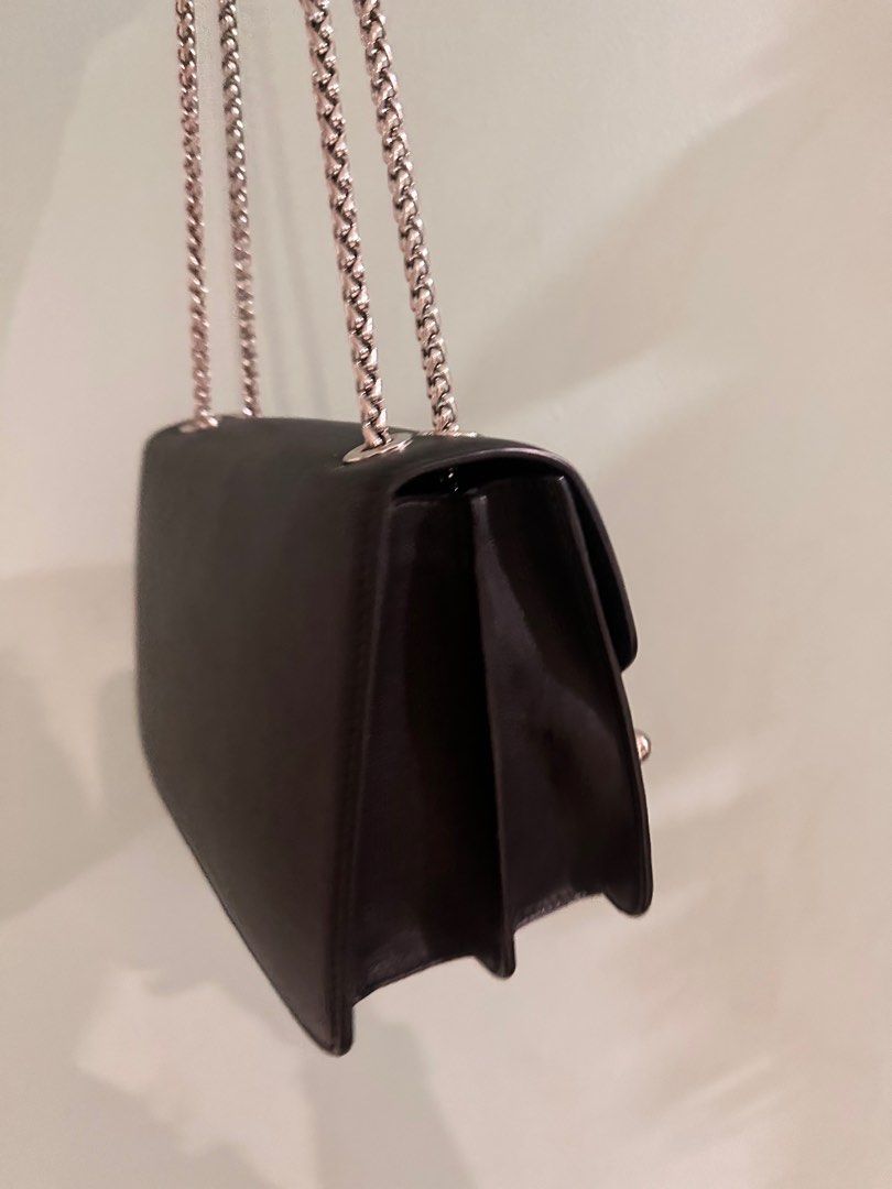 Strathberry Eastwest Tote Black (Category: Luxury Bags & Wallets) located in Manila. Submitted by brielliant (Listing ID 1396038291, Image 2). Description: - Black Strathberry Eastwest Bag - Silver chain strap - Signature bar closure - Structured design - Flap closure - Spacious interior - Strathberry logo detail There are signs of usage see photos With receipt for authenticity Orig price 42500 Price now is 54500 Not in the rush to sell, will onl