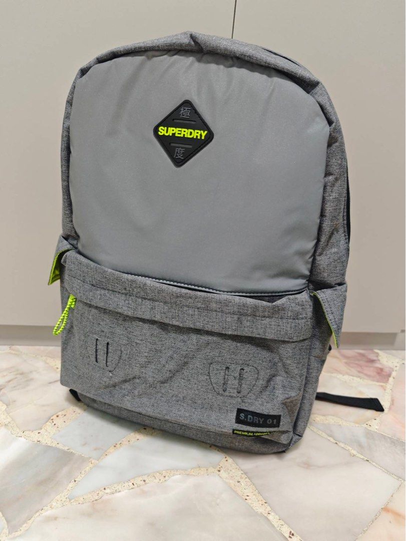 Superdry Grey Backpack (Category: Backpacks) located in Singapore. Submitted by eking (Listing ID 1396068310, Image 1). Description: Superdry Refelective Montana, Men’s Backpack, Grigio (Grey Marl) - Stylish grey color. - Spacious main compartment. - Front pocket for easy access. - Versatile design for school, work, or travel. - 30.0x45.0x15.0 cm (W x H L) Never used and kept in closet all the times .