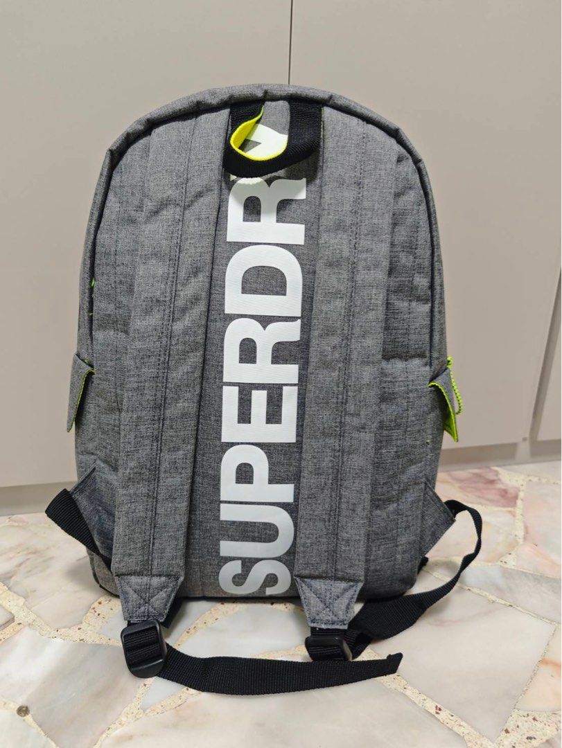 Superdry Grey Backpack (Category: Backpacks) located in Singapore. Submitted by eking (Listing ID 1396068310, Image 2). Description: Superdry Refelective Montana, Men’s Backpack, Grigio (Grey Marl) - Stylish grey color. - Spacious main compartment. - Front pocket for easy access. - Versatile design for school, work, or travel. - 30.0x45.0x15.0 cm (W x H L) Never used and kept in closet all the times .