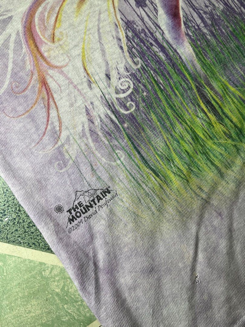 The Mountain Unicorn T-shirt (Category: Tshirts & Polo Shirts ) located in Cavite. Submitted by robievillon (Listing ID 1396094122, Image 2). Description: 21x30” - The Mountain t-shirt with a unicorn, castle, and rainbow design. - Features a purple tie-dye effect. - Crew neck style. - Designed in 2009..