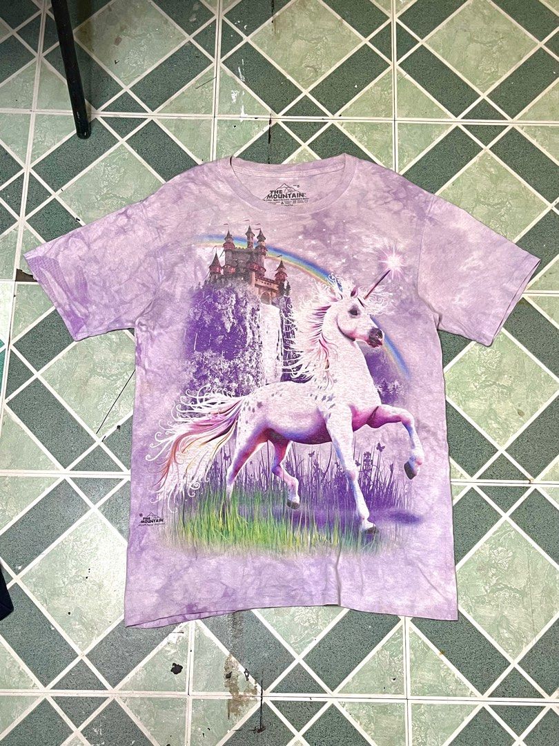 The Mountain Unicorn T-shirt (Category: Tshirts & Polo Shirts ) located in Cavite. Submitted by robievillon (Listing ID 1396094122, Image 1). Description: 21x30” - The Mountain t-shirt with a unicorn, castle, and rainbow design. - Features a purple tie-dye effect. - Crew neck style. - Designed in 2009..