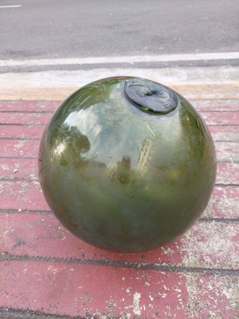Vintage Glass Buoy (Category: Other Home Decor) located in Makati City. Submitted by tahanan (Listing ID 1396063430, Image 3). Description: - Green Glass Buoy - 12 inches Diameter - Smooth surface - Features a small indentation .