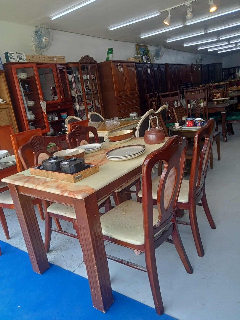 Wooden Dining Table with Chairs (Category: Tables & Sets) located in Manila. Submitted by coolwhale-0343 (Listing ID 1395953877, Image 3). Description: - Wooden dining table with a marble-like top - Includes six matching chairs with cushioned seats - Dark brown finish - Sturdy and well-maintained - Perfect for family meals or entertaining - Classic look.