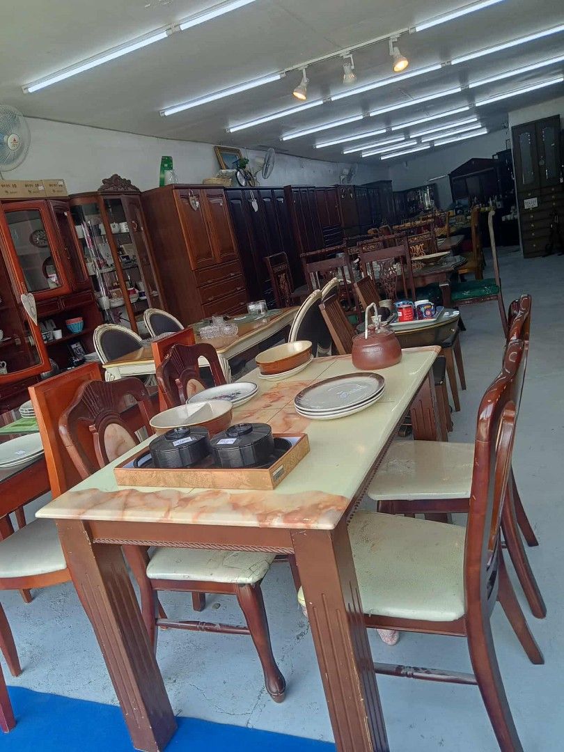 Wooden Dining Table with Chairs (Category: Tables & Sets) located in Manila. Submitted by coolwhale-0343 (Listing ID 1395953877, Image 1). Description: - Wooden dining table with a marble-like top - Includes six matching chairs with cushioned seats - Dark brown finish - Sturdy and well-maintained - Perfect for family meals or entertaining - Classic look.
