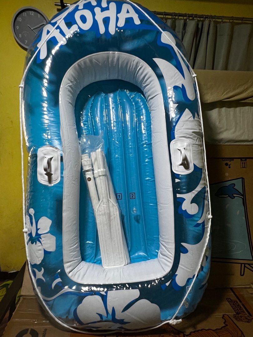 Aloha Inflatable Boat (Category: Water Sports) located in Quezon City. Submitted by daday39 (Listing ID 1399305554, Image 2). Description: - New inflatable boat - Blue and white design with 'Aloha' text - Includes oars - Features carrying handles - Perfect for water activities With plastic paddles No box 198x117cm.