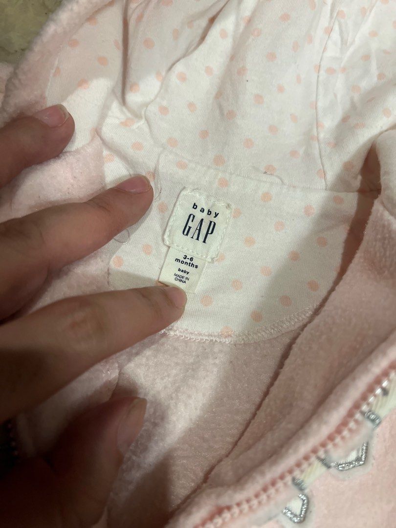 Baby GAP Pink Hoodie Jacket (Category: Babies & Kids Fashion) located in Quezon City. Submitted by zaria22 (Listing ID 1399367387, Image 2). Description: - preloved GAP baby hoodie jacket - Soft pink color - Features ruffle hem and bear ears on the hood - Full zipper closure - Polka dot pattern inside hood - GAP logo on front - Size: 3-6 months.