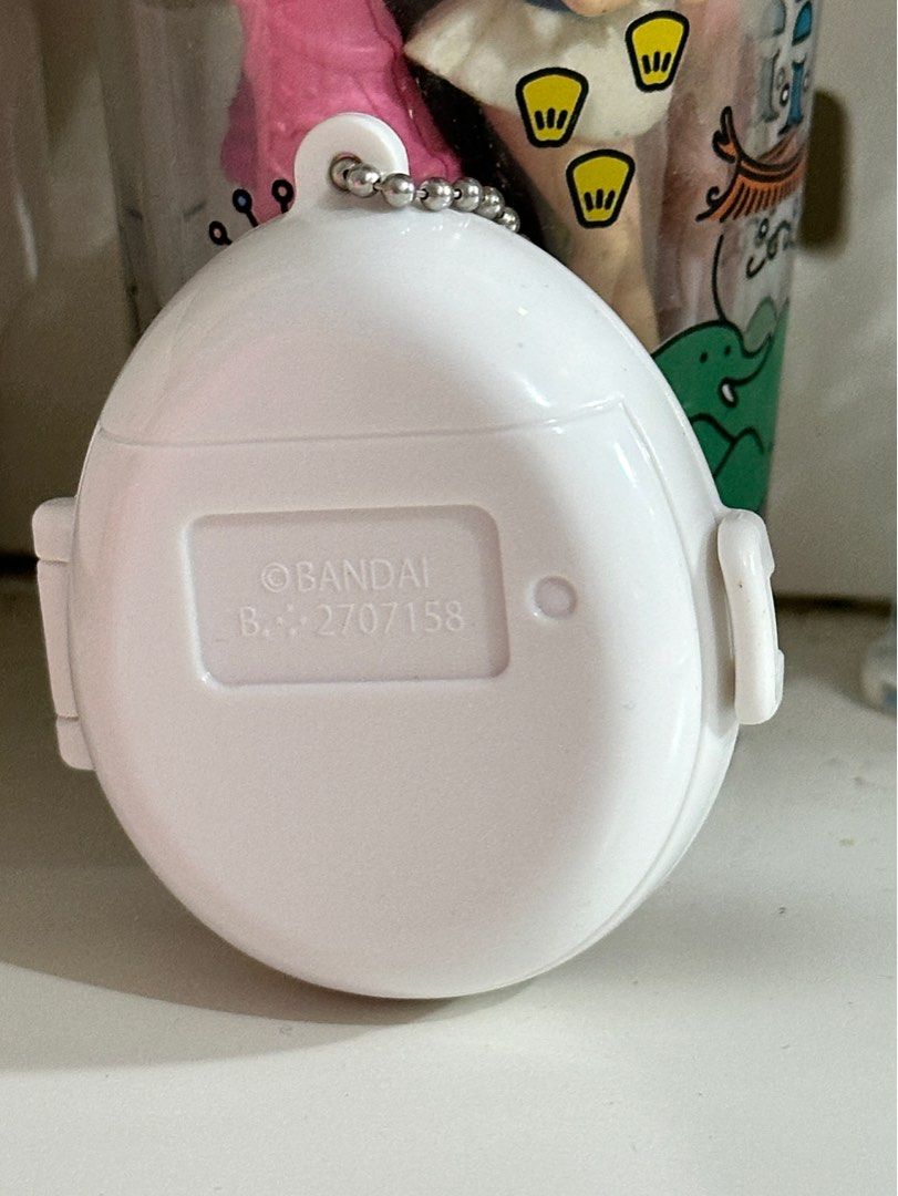 BANDAI Tamagotchi Swing Case Mimitchi (Category: Interactive Toys) located in Cainta. Submitted by pomocha (Listing ID 1399379769, Image 3). Description: 🍀rfs: Never used, got it as a dupe 🍀 dm me if interested 🍀MOD: j&t, lalamove, lbc.