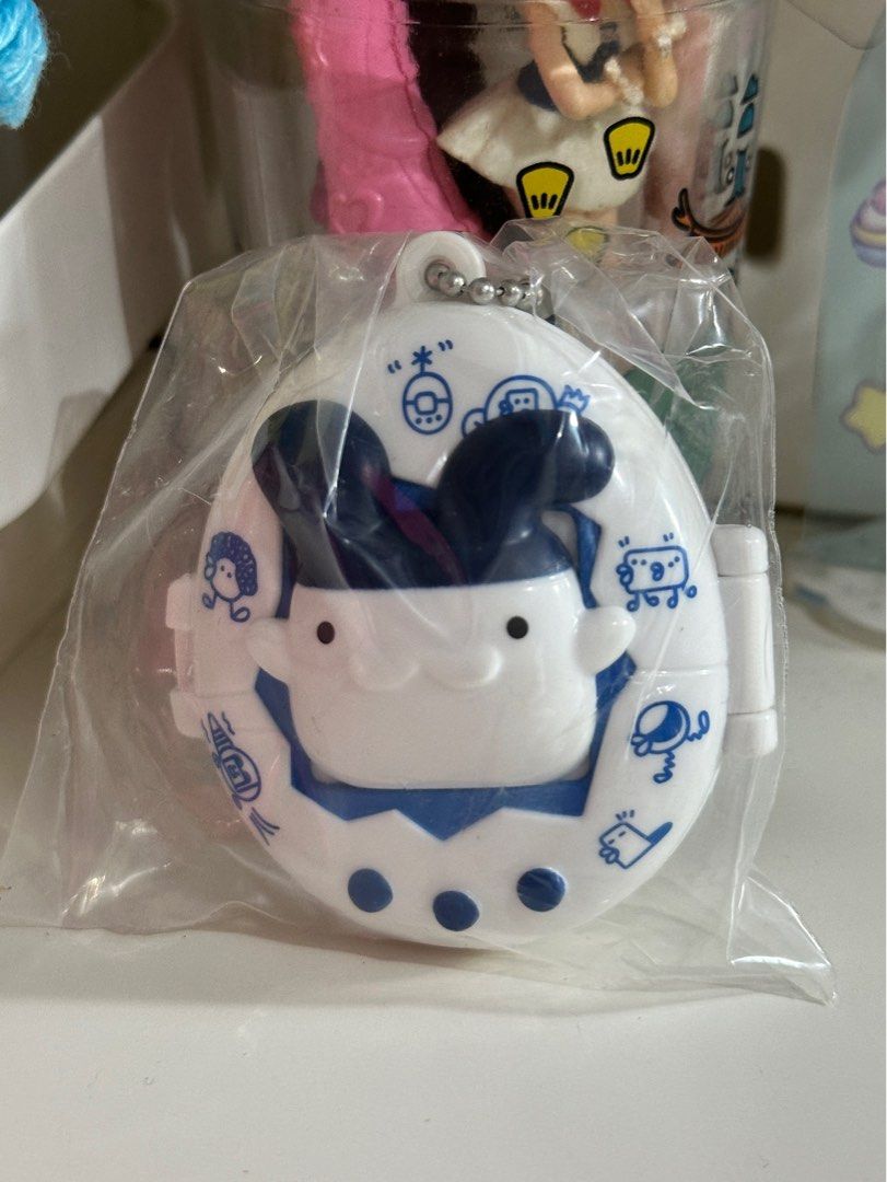BANDAI Tamagotchi Swing Case Mimitchi (Category: Interactive Toys) located in Cainta. Submitted by pomocha (Listing ID 1399379769, Image 1). Description: 🍀rfs: Never used, got it as a dupe 🍀 dm me if interested 🍀MOD: j&t, lalamove, lbc.