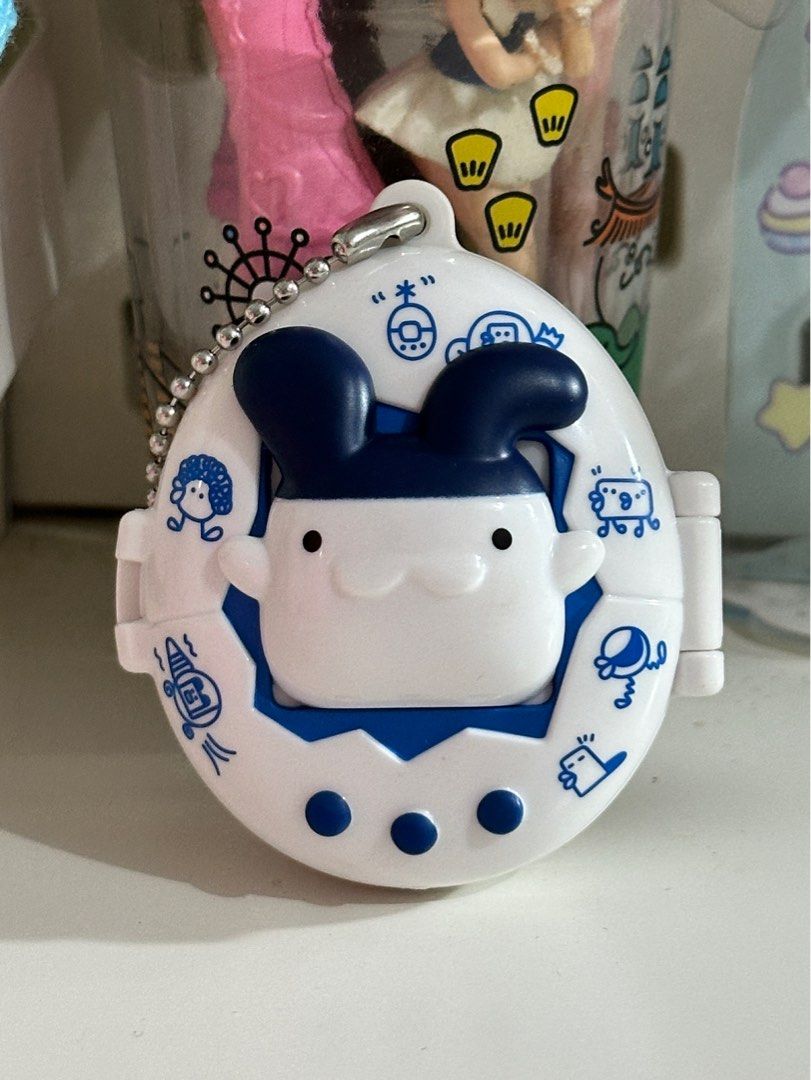 BANDAI Tamagotchi Swing Case Mimitchi (Category: Interactive Toys) located in Cainta. Submitted by pomocha (Listing ID 1399379769, Image 2). Description: 🍀rfs: Never used, got it as a dupe 🍀 dm me if interested 🍀MOD: j&t, lalamove, lbc.