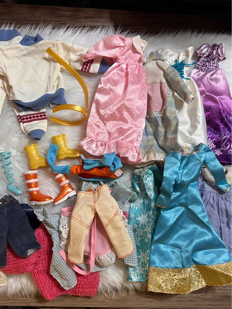 Barbie Dolls and Accessories Set (Category: Kids Toys) located in Lubao. Submitted by mioreecollection (Listing ID 1399364803, Image 2). Description: TAKE ALL | pls manage your expectations these are preloved items | Needs wash po - Frozen doll collection for sale! - Includes multiple dolls with varying hair colors and skin tones. - Comes with a variety of outfits: dresses, tops, pants, and shoes. - Features a pink kitchen set with table, chairs,