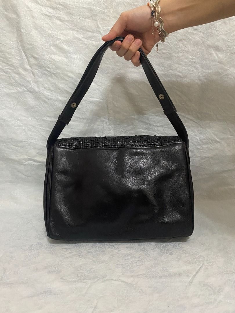 Black Cross Woven Leather Handbag (Category: Luxury Bags & Wallets) located in Rizal. Submitted by protractor (Listing ID 1399324908, Image 2). Description: ⭐️ Pre-loved ⭐️ Small- Medium ⭐️ In Very Good condition Location: Taytay Rizal Payment: GCASH SF: shoulder by buyer Send a PM for more pictures and info! .