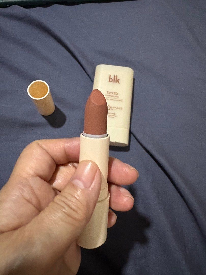 blk Cosmetics Tinted Sunscreen Stick & Lipstick (Category: Makeup) located in Quezon City. Submitted by brandedthingsforless (Listing ID 1399390270, Image 3). Description: - blk Cosmetics Tinted Sunscreen Stick SPF 50: Shade : oat - Matte finish - Sweat and water resistant - blk Cosmetics Fluffmatte Lipstick in "On Repeat": - Nude-brown shade - Both items are swiped once and in original packaging. - sf to be shouldered by buyer.