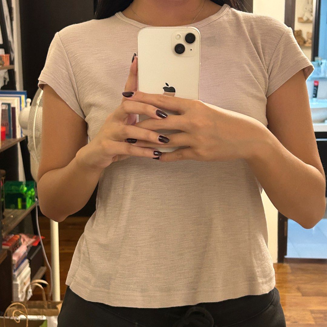 brandy melville hallie top (Category: Shirts) located in Pasig City. Submitted by enneil (Listing ID 1399407080, Image 3). Description: love the fit of these tops sm more of a cream colour than white, has some discoloration on the neck bc of laundry.
