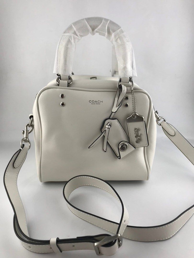 Coach Cube Rogue Bag 20 (Category: Cross-body Bags) located in Marikina City. Submitted by smthxtra (Listing ID 1399421755, Image 3). Description: Length: 8.0” Height: 7.0” Width: 7.0” Glazed leather Fabric lining Handles with 4” drop Detachable strap with 21.5” drop for shoulder or crossbody wear Outside zip pocket Inside zip pocket Zip closure Four protective feet at base With tag, care card, dust bag, and paper bag.
