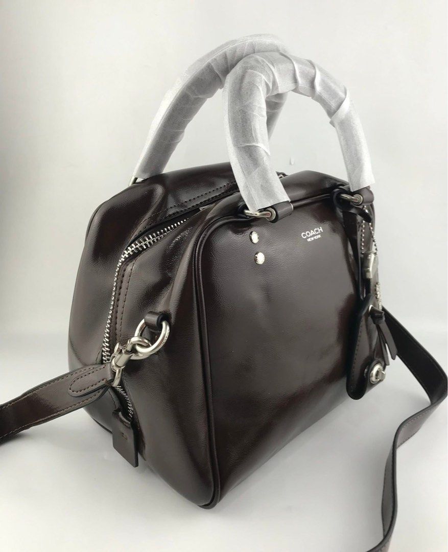 Coach Cube Rogue Bag 20 (Category: Cross-body Bags) located in Marikina City. Submitted by smthxtra (Listing ID 1399421945, Image 3). Description: Length: 8.0” Height: 7.0” Width: 7.0” Glazed leather Fabric lining Handles with 4” drop Detachable strap with 21.5” drop for shoulder or crossbody wear Outside zip pocket Inside zip pocket Zip closure Four protective feet at base With tag, care card, dust bag, and paper bag.