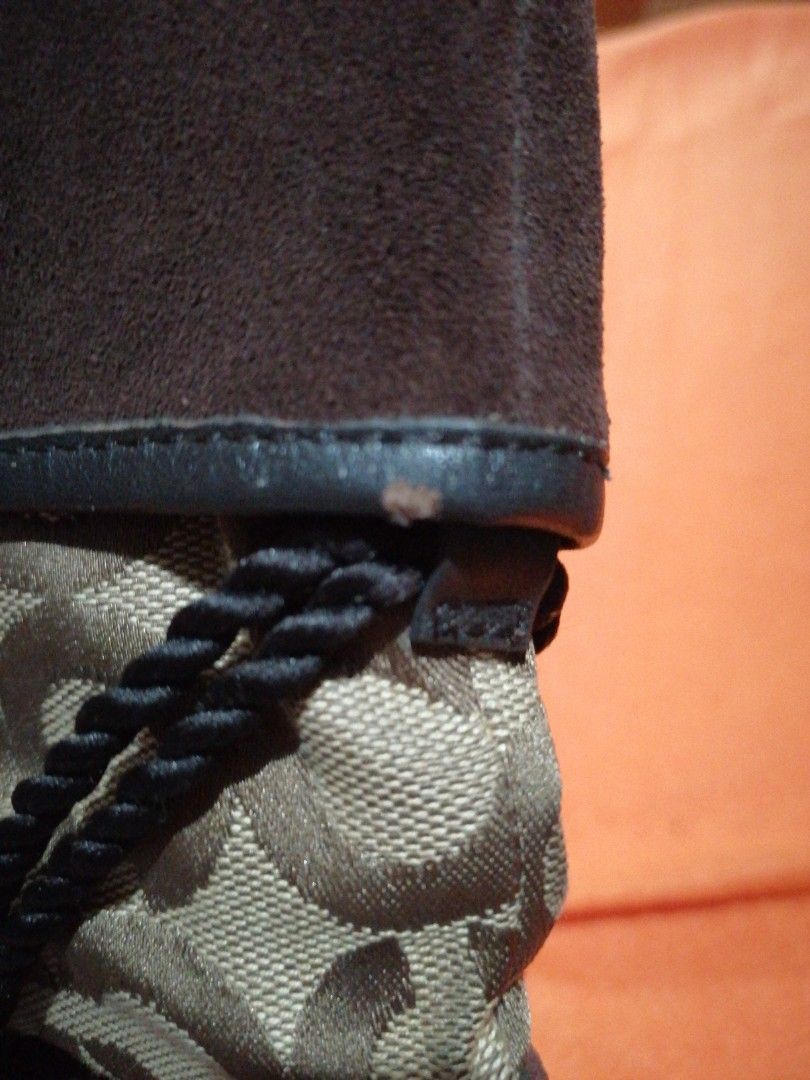 Coach Wedge Boots (Category: Boots) located in Pasay City. Submitted by cydail (Listing ID 1399307112, Image 3). Description: - Coach wedge boots - Brown suede upper - Signature Coach pattern - Lace-up design - Wedge heel - Textured black sole - Adds designer flair.