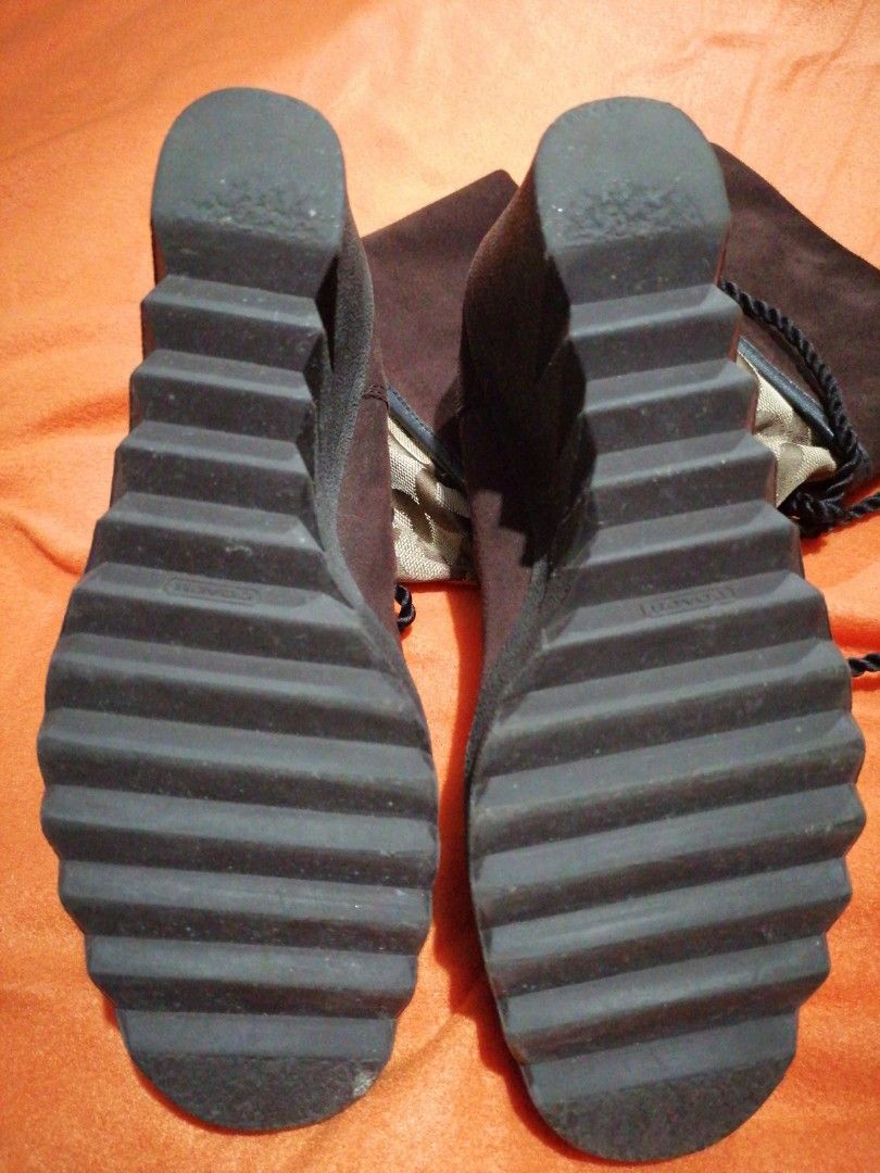 Coach Wedge Boots (Category: Boots) located in Pasay City. Submitted by cydail (Listing ID 1399307112, Image 2). Description: - Coach wedge boots - Brown suede upper - Signature Coach pattern - Lace-up design - Wedge heel - Textured black sole - Adds designer flair.