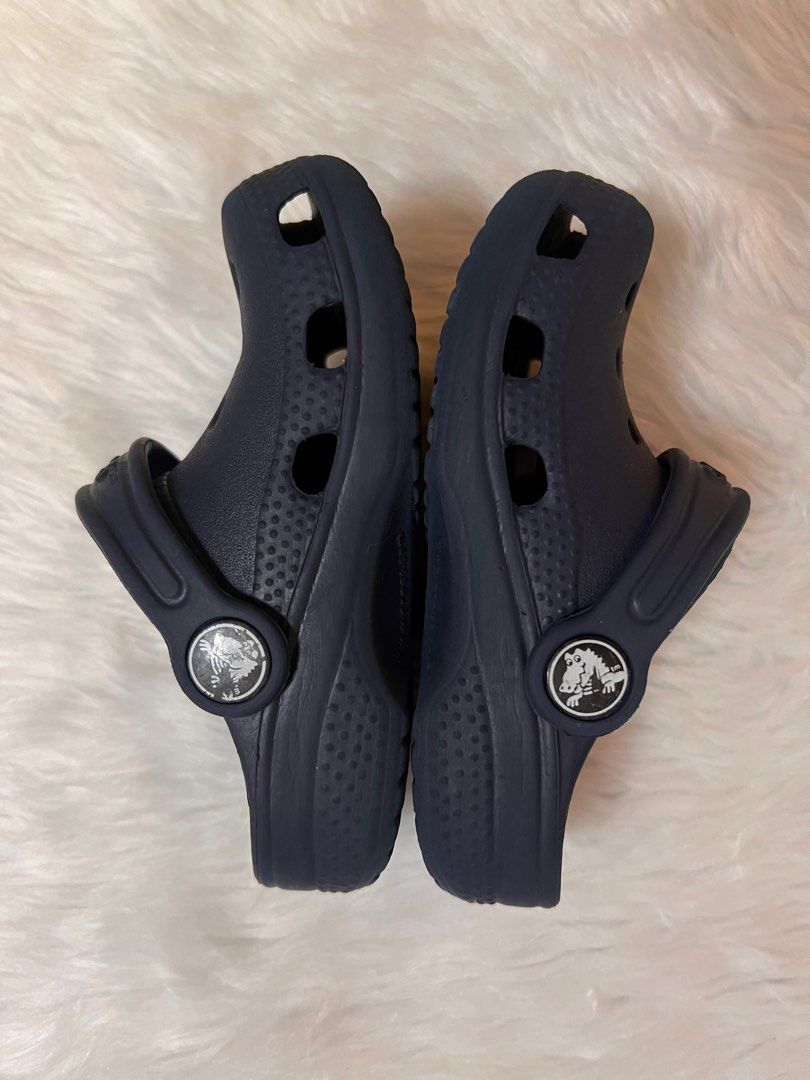 Crocs Navy Blue Clogs (Category: Babies & Kids Fashion) located in Lubao. Submitted by mioreecollection (Listing ID 1399387498, Image 2). Description: - Navy blue Crocs clogs - Features Crocs logo - Size visible on sole - Comfortable and easy to clean - Perfect for everyday wear.