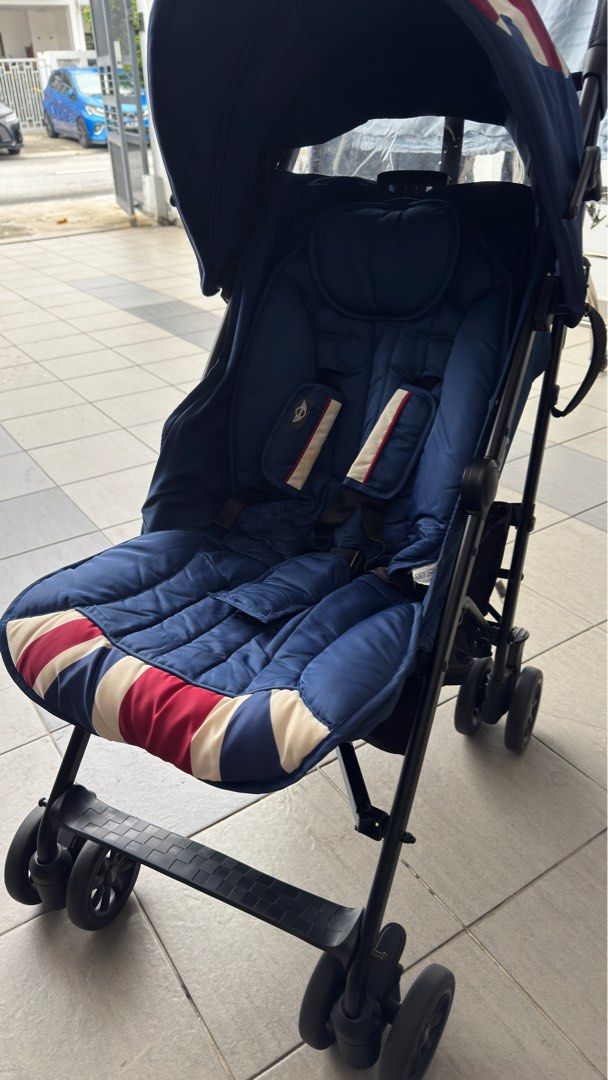 Easywalker Mini Stroller (Category: Strollers) located in Shah Alam. Submitted by bbball (Listing ID 1399337849, Image 2). Description: - Easywalker Mini stroller - Navy blue with Union Jack design - Black frame - Compact and lightweight - Padded seat - Sunshade - Curved handle for easy maneuvering - Suitable for travel.