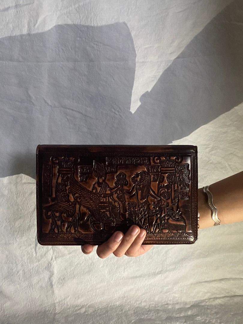Egyptian Brown Leather Clutch Bag (Category: Clutches) located in Rizal. Submitted by protractor (Listing ID 1399327331, Image 2). Description: ⭐️ Pre-loved ⭐️ Small ⭐️ In Very Good condition Location: Taytay Rizal Payment: GCASH SF: shoulder by buyer Send a PM for more pictures and info! ✨Shiny finish ✨Flap closure ✨Black interior.