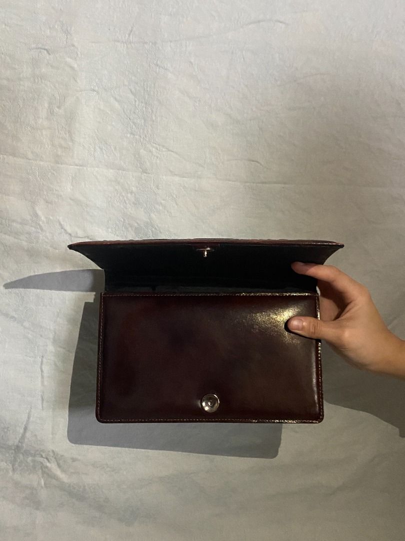 Egyptian Brown Leather Clutch Bag (Category: Clutches) located in Rizal. Submitted by protractor (Listing ID 1399327331, Image 3). Description: ⭐️ Pre-loved ⭐️ Small ⭐️ In Very Good condition Location: Taytay Rizal Payment: GCASH SF: shoulder by buyer Send a PM for more pictures and info! ✨Shiny finish ✨Flap closure ✨Black interior.