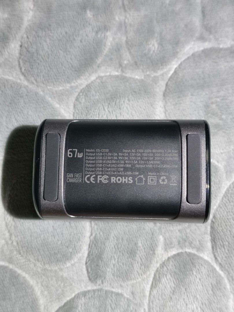 Essager 67W GaN Desk Charger Type C (Category: Chargers & Cables) located in Manila. Submitted by elladejesus.05 (Listing ID 1399249266, Image 3). Description: - Essager 67W GaN Desk Charger - 2 USB-A and 2 Type-C ports - Supports PD and QC fast charging - EU plug - Multiple safety features - Sleek black design - Includes charger and power cable.