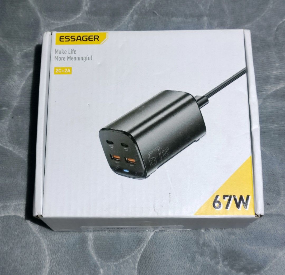 Essager 67W GaN Desk Charger Type C (Category: Chargers & Cables) located in Manila. Submitted by elladejesus.05 (Listing ID 1399249266, Image 2). Description: - Essager 67W GaN Desk Charger - 2 USB-A and 2 Type-C ports - Supports PD and QC fast charging - EU plug - Multiple safety features - Sleek black design - Includes charger and power cable.