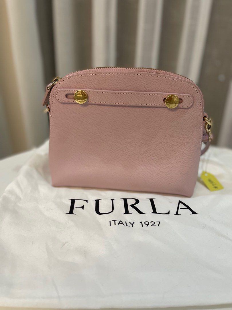 Furla Metropolis Mini Crossbody Bag (Category: Luxury Bags & Wallets) located in Makati City. Submitted by triftedandbranded (Listing ID 1399383968, Image 1). Description: - Authentic Furla Metropolis Mini crossbody bag - Soft pink color - Top zip closure - Gold-tone hardware - Detachable shoulder strap - Main compartment and slip pocket - Includes dust bag - Original tags.