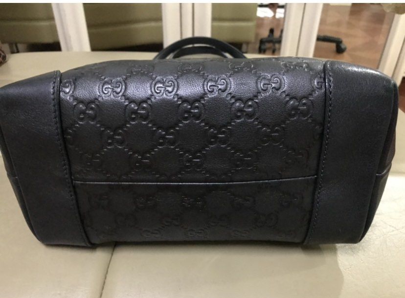 Gucci Black Leather Tote Bag (Category: Luxury Bags & Wallets) located in Quezon City. Submitted by tinylee60 (Listing ID 1399413155, Image 3). Description: - Authentic Gucci tote bag - Black leather with embossed logo - Double top handles - Gold-tone hardware - Detachable logo charm - Spacious interior - Structured base - Classic and elegant design.