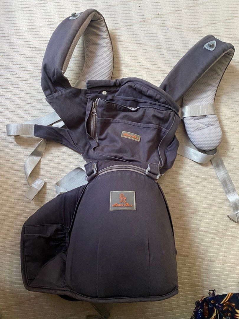 Happy Walk Baby Carrier (Category: Carriers & Slings) located in Cebu City. Submitted by esmebusiness (Listing ID 1399307075, Image 1). Description: - Happy Walk baby carrier - Dark gray color - Adjustable straps and buckles - Padded headrest - Front pocket with zipper - Breathable mesh back panel - Comfortable and supportive design.