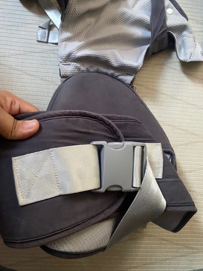 Happy Walk Baby Carrier (Category: Carriers & Slings) located in Cebu City. Submitted by esmebusiness (Listing ID 1399307075, Image 3). Description: - Happy Walk baby carrier - Dark gray color - Adjustable straps and buckles - Padded headrest - Front pocket with zipper - Breathable mesh back panel - Comfortable and supportive design.