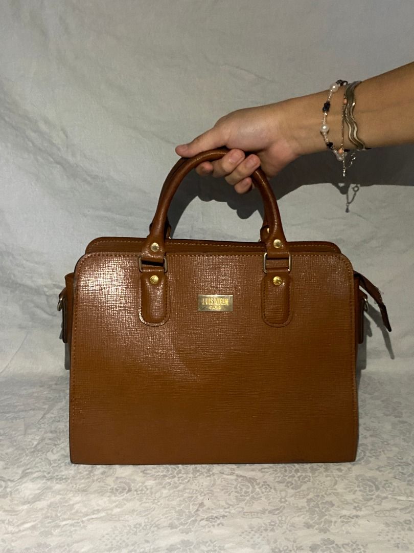 LUIS VIGIN | Brown Handbag with Top Handles (Category: Luxury Bags & Wallets) located in Rizal. Submitted by protractor (Listing ID 1399332806, Image 1). Description: ⭐️ Pre-loved ⭐️ Small-Medium ⭐️ In Very Good condition Location: Taytay Rizal Payment: GCASH SF: shoulder by buyer Send a PM for more pictures and info! .