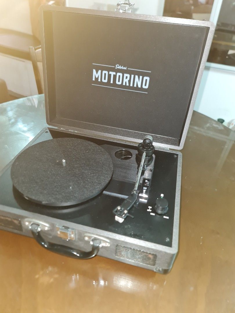 Motorino Suitcase Record Player with Vinyl Records (Category: Portable Music Players) located in Mandaluyong City. Submitted by jldo28 (Listing ID 1399443854, Image 1). Description: - Motorino suitcase record player - Built-in speakers - Includes vinyl records (Frank Sinatra, Jo Stafford, and more) - Portable design with a handle - Features DC 12V input - RCA output and line in ports - In good working condition.