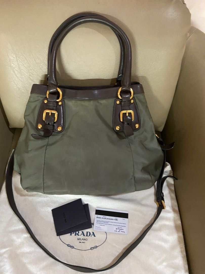 Prada Nylon Jacquard Fumo Handbag (Category: Luxury Bags & Wallets) located in Quezon City. Submitted by tinylee60 (Listing ID 1399402941, Image 2). Description: - Authentic Prada handbag - Olive green nylon with brown leather trim - Double top handles and detachable shoulder strap - Gold-tone hardware - Interior zip pocket and Prada logo plaque - Includes dust bag, authenticity card, and care card.