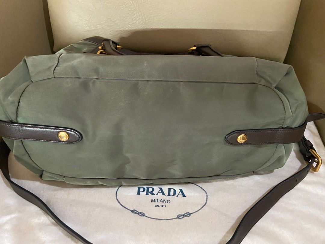 Prada Nylon Jacquard Fumo Handbag (Category: Luxury Bags & Wallets) located in Quezon City. Submitted by tinylee60 (Listing ID 1399402941, Image 3). Description: - Authentic Prada handbag - Olive green nylon with brown leather trim - Double top handles and detachable shoulder strap - Gold-tone hardware - Interior zip pocket and Prada logo plaque - Includes dust bag, authenticity card, and care card.