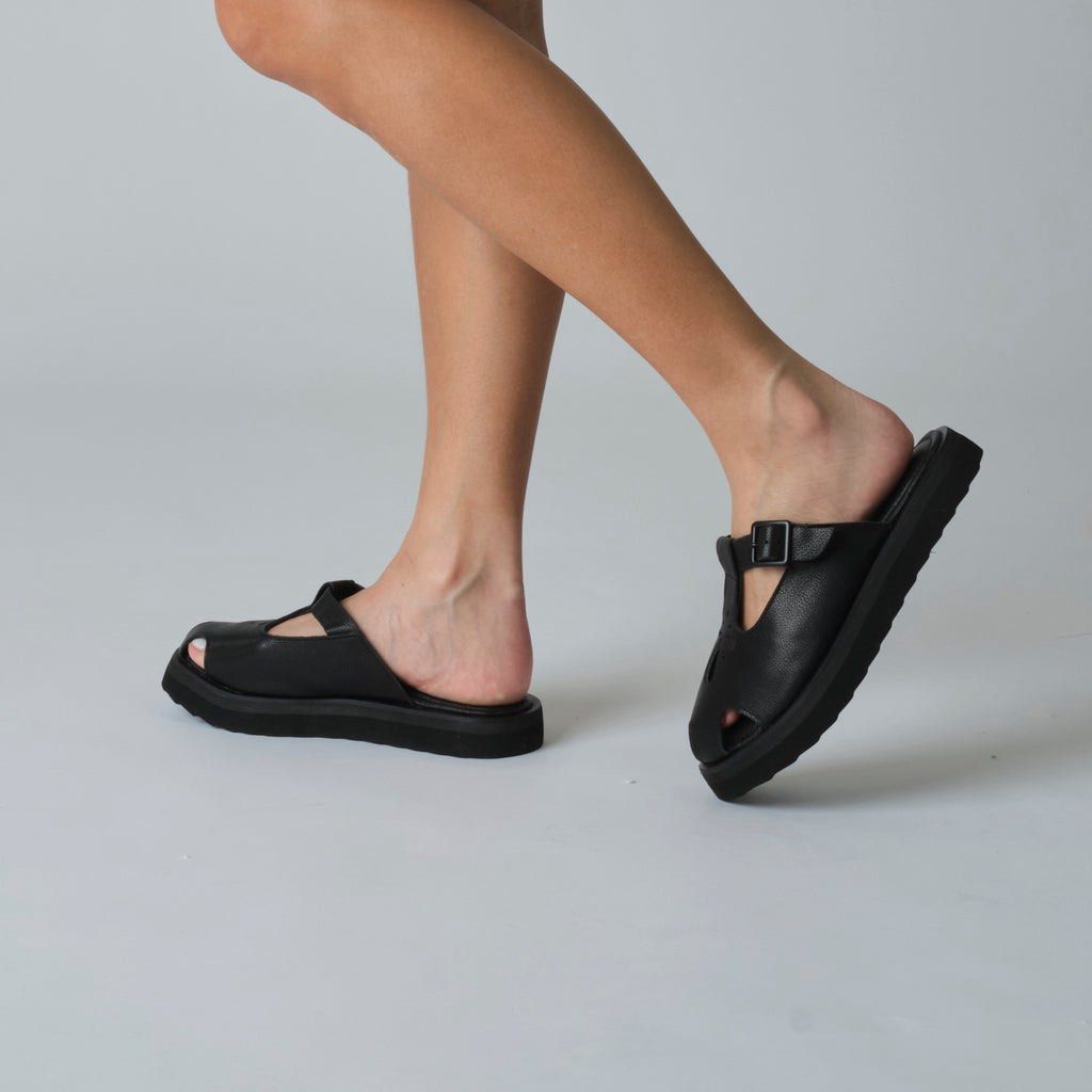 Renegade Folk Figures Chunky Mules - Black (Category: Flats & Sandals) located in Rizal. Submitted by matchapeppernacho (Listing ID 1399278487, Image 3). Description: - Renegade Folk Black Figures Mules -used less 10x, stored - T-strap design with buckle closure - Made of leather - All black -Fixed price.