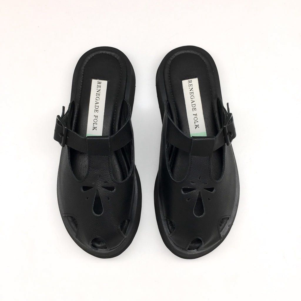 Renegade Folk Figures Chunky Mules - Black (Category: Flats & Sandals) located in Rizal. Submitted by matchapeppernacho (Listing ID 1399278487, Image 2). Description: - Renegade Folk Black Figures Mules -used less 10x, stored - T-strap design with buckle closure - Made of leather - All black -Fixed price.