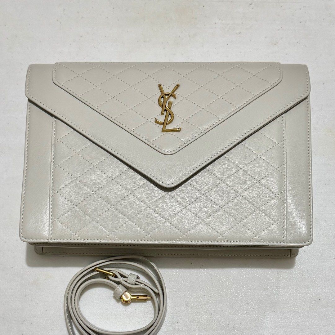 Saint Laurent Gaby Envelope Clutch Bag (Category: Luxury Bags & Wallets) located in Quezon City. Submitted by nanaskbeauty (Listing ID 1399403357, Image 1). Description: - Saint Laurent Gaby Envelope Clutch Bag - With Code - White (Light grey color) - Quilted design - Gold-tone logo - Detachable adjustable shoulder strap - Flap closure Lowering the price due to minor cat scratches Comes with: - Dust Bag - Booklet Help me declutter! Bigger discoun