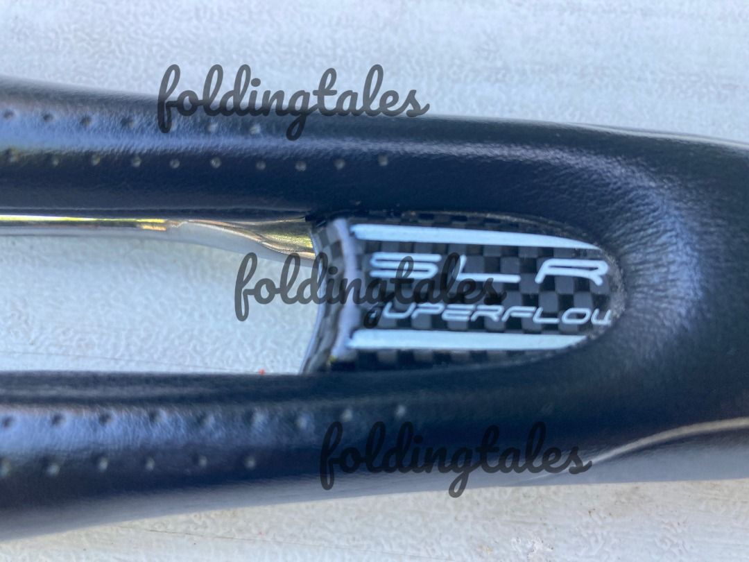 Selle Italia SLR TM Superflow Saddle (Category: Bicycles) located in Quezon City. Submitted by i4nt4n (Listing ID 1399301118, Image 1). Description: - Selle Italia SLR Superflow saddle - Black color - Silver rails - Carbon fiber detail with SLR Superflow branding - Center cutout for pressure relief.