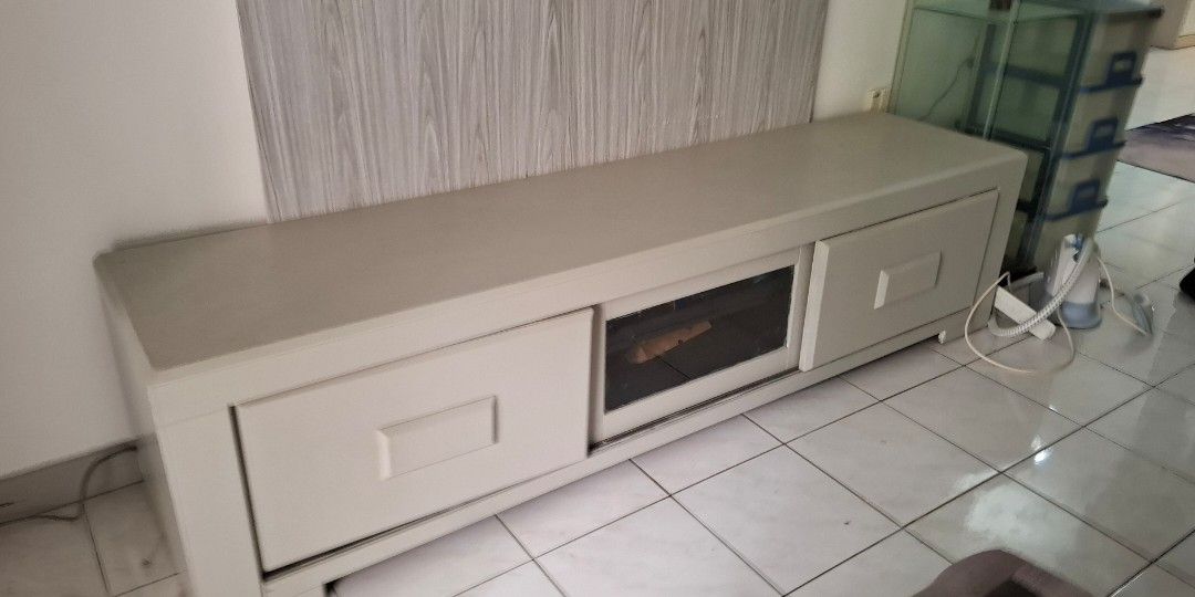 Solid TV console 6 feets (Category: TV Consoles) located in Kuala Lumpur. Submitted by martkeshi (Listing ID 1399353138, Image 1). Description: large tv console letting go at very cheap price... previously dark walnut colour, painted it light grey as we change the colour concept of the house. overall is as good as u can see in the photo. self arrange pick up from Bukit OUG Condo..