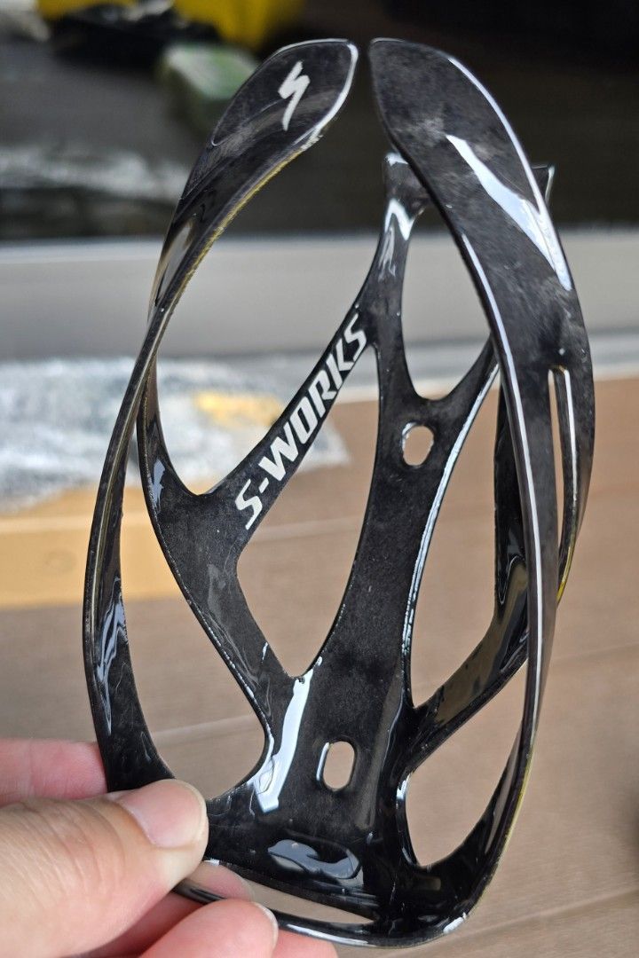 Specialized S-Works Bottle Cages (OEM) (Category: Parts & Accessories) located in Singapore. Submitted by r.o.g.e.r (Listing ID 1399280852, Image 2). Description: - Specialized S-Works bottle cages - Lightweight design - Weight: 26g per piece - Ideal for road or mountain bikes.