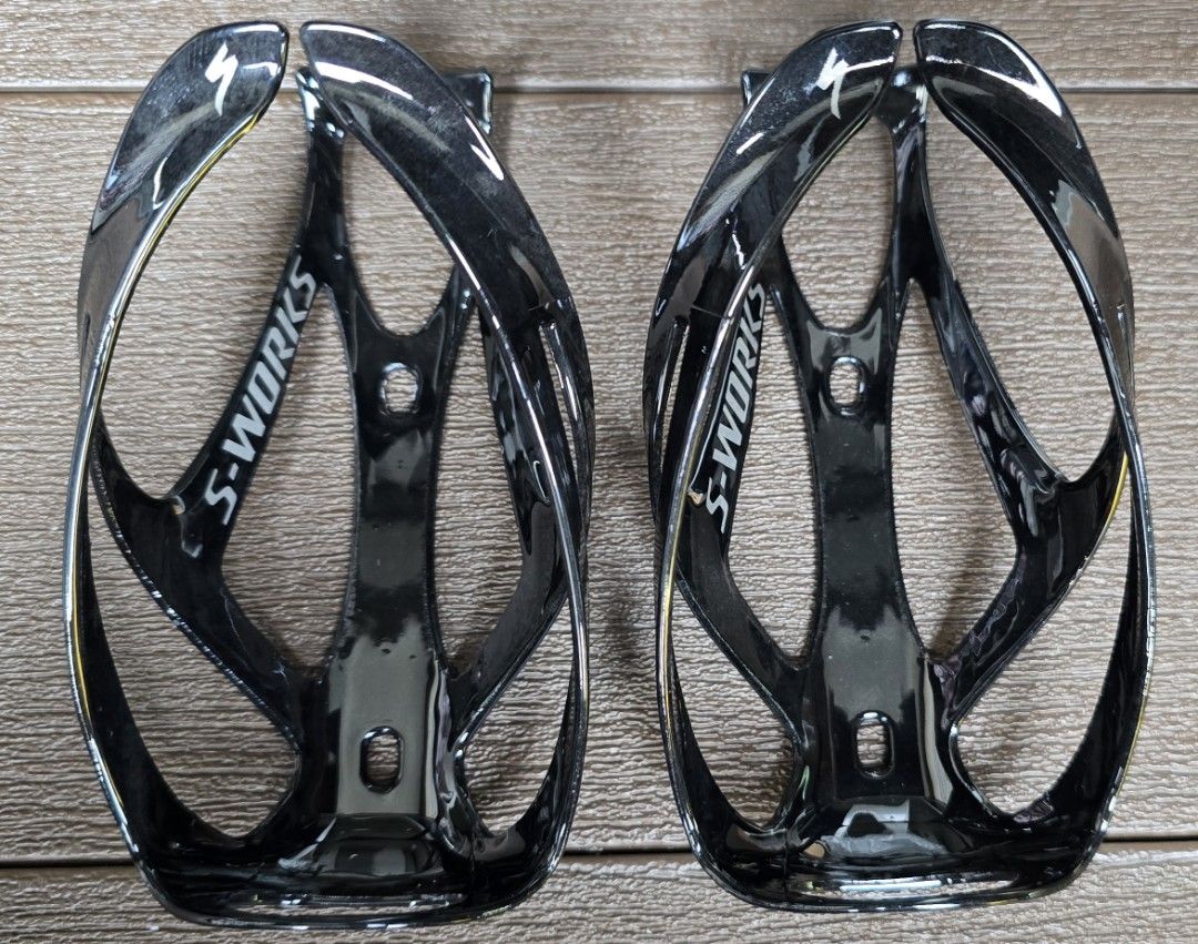 Specialized S-Works Bottle Cages (OEM) (Category: Parts & Accessories) located in Singapore. Submitted by r.o.g.e.r (Listing ID 1399280852, Image 1). Description: - Specialized S-Works bottle cages - Lightweight design - Weight: 26g per piece - Ideal for road or mountain bikes.