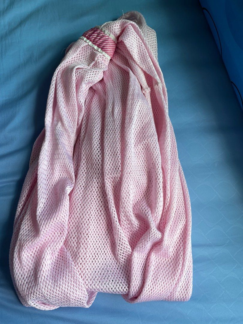 Spring cot net (Category: Laundry Baskets) located in Singapore. Submitted by leyl8 (Listing ID 1399249791, Image 1). Description: - Pink mesh laundry bag - Protects delicate clothing during washing - Drawstring closure.