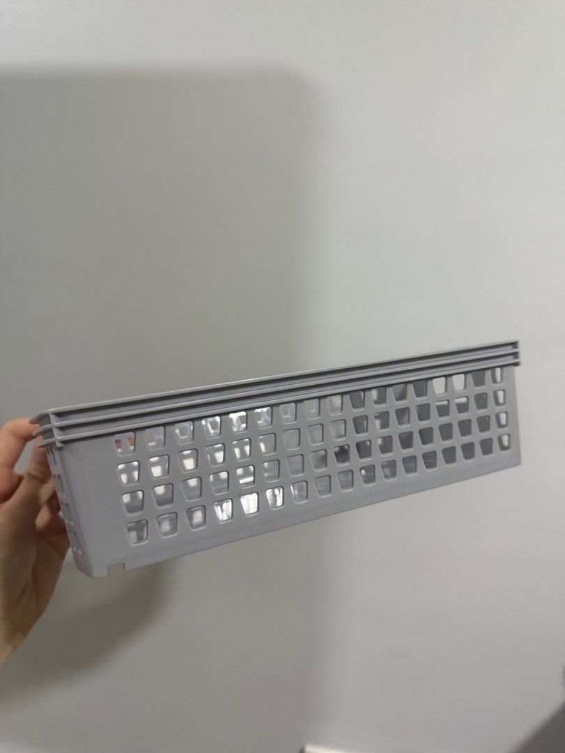 Stackable Storage Basket Grey (Category: Storage Boxes & Baskets) located in Manila. Submitted by caitlinmoon (Listing ID 1399393636, Image 2). Description: - Set of stackable storage baskets - Color: Gray - Shape: Rectangular - Design: Perforated - Material: Plastic - Ideal for organizing various items - Space-saving design.