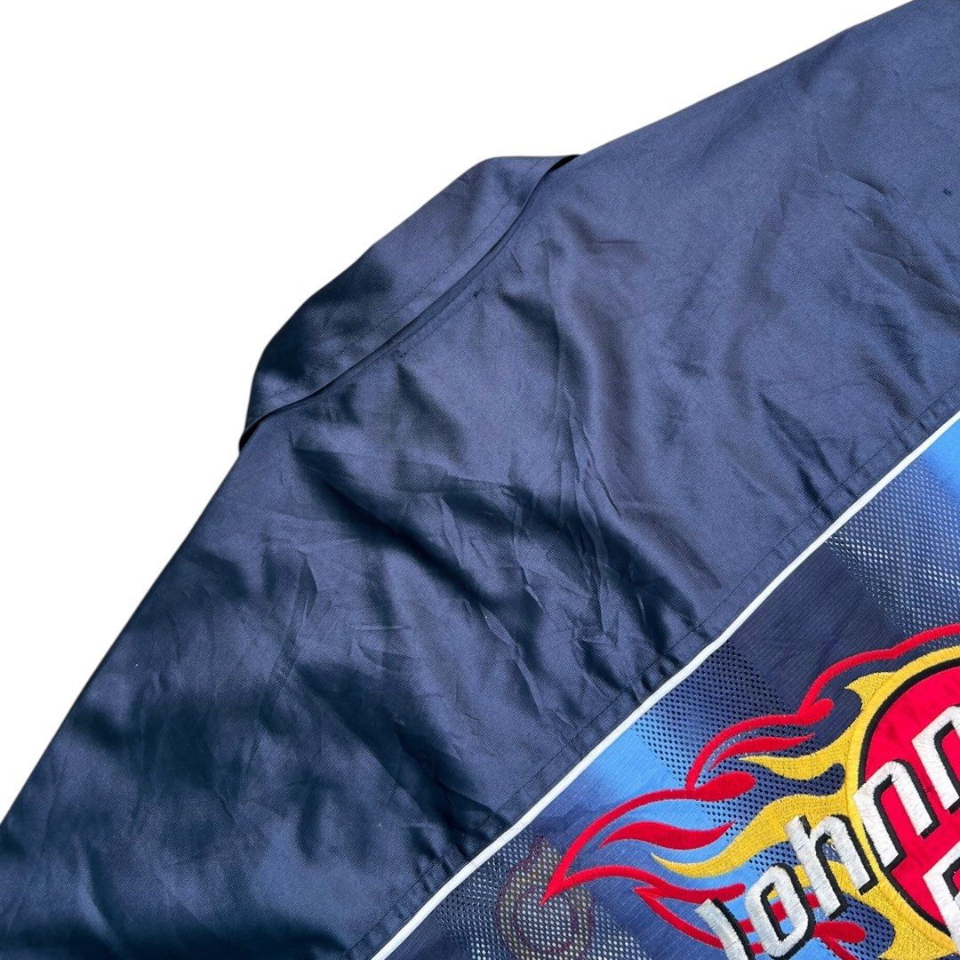 Ultra Rare Vntg Johnny Blaze Jacket (Category: Tshirts & Polo Shirts ) located in San Pedro. Submitted by drip_from_thrift (Listing ID 1399405383, Image 2). Description: - Johnny Blaze jacket - Unique design with blue and white accents - Embroidered Johnny Blaze logo on back and chest - Full zip closure - Collared neckline - Short sleeves - Size F - Made in Korea - 24/30 .