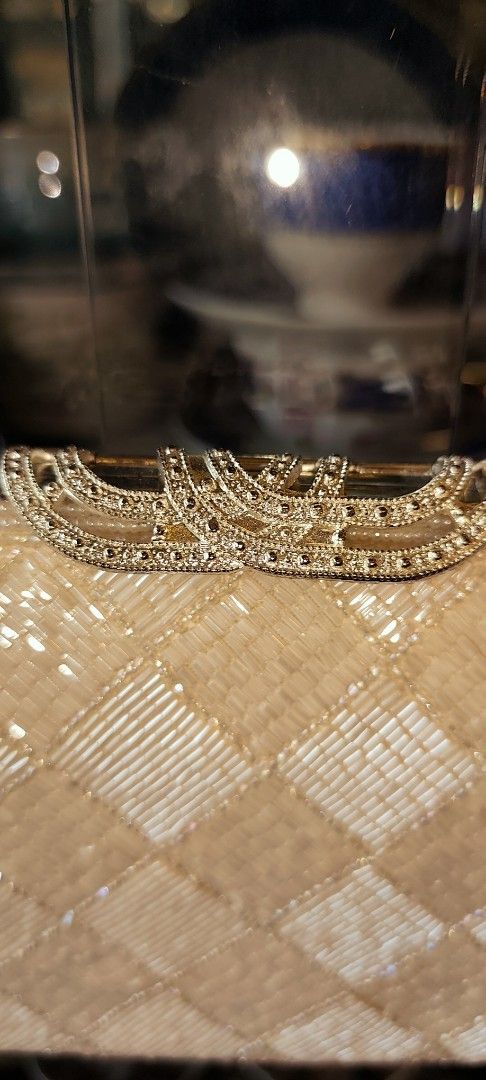 Vintage Beaded Handbag with Embellishments (Category: Luxury Bags & Wallets) located in Caloocan City. Submitted by tamayo_loren-98918 (Listing ID 1399434954, Image 1). Description: - Vintage quilted handbag - Features beaded embellishments - Neutral cream/beige color - Small, evening clutch style.