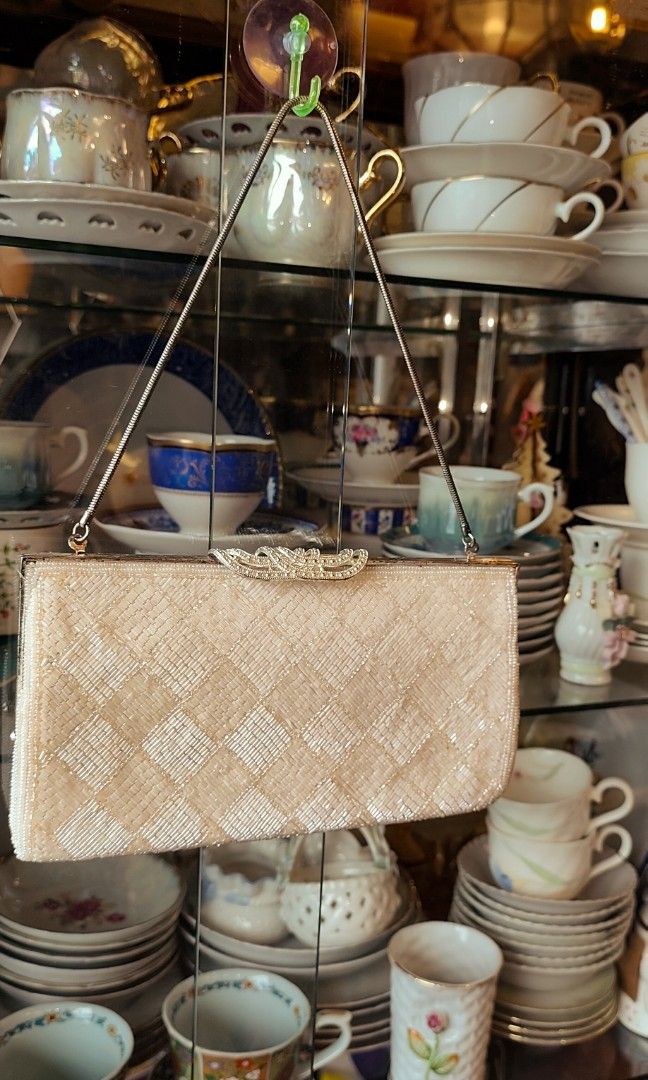 Vintage Beaded Handbag with Embellishments (Category: Luxury Bags & Wallets) located in Caloocan City. Submitted by tamayo_loren-98918 (Listing ID 1399434954, Image 2). Description: - Vintage quilted handbag - Features beaded embellishments - Neutral cream/beige color - Small, evening clutch style.